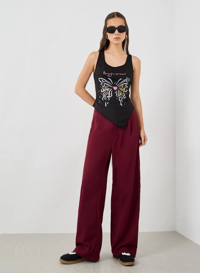 تايك تو توب بدون أكمام بطبعة جرافيك ورقبة مستديرة